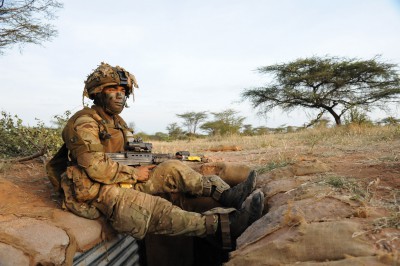Gurkha soldier taking a rest on top of a trench during an exercise in Kenya